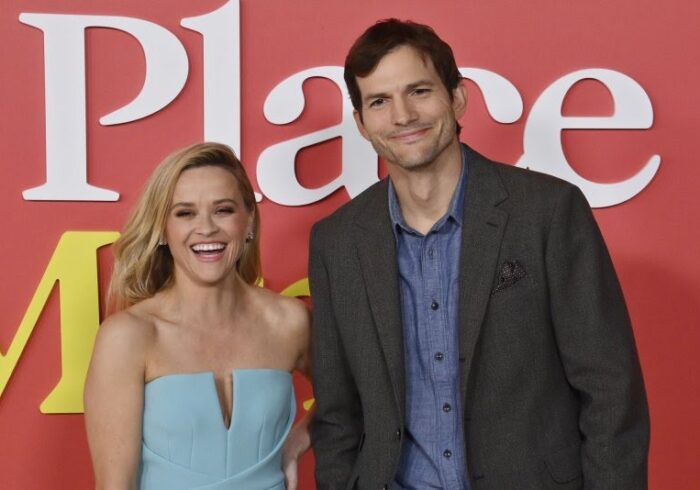 Ashton Kutcher says he stood awkwardly around Reese Witherspoon on the 'Your Place or Mine' red carpet to prevent affair rumors