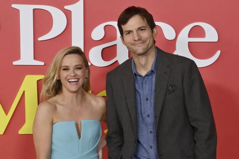 Ashton Kutcher says he stood awkwardly around Reese Witherspoon on the 'Your Place or Mine' red carpet to prevent affair rumors